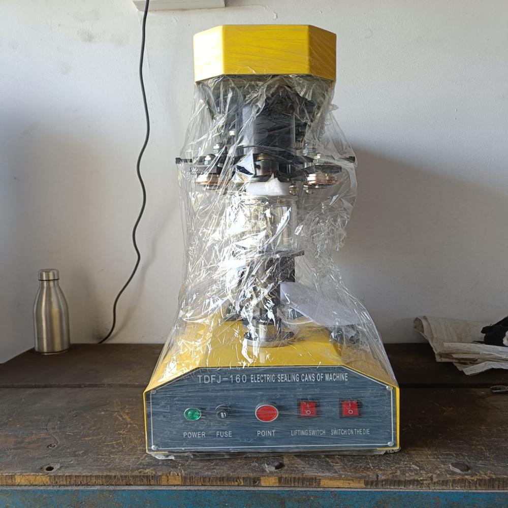 Pet Can Sealing Machine by Gurukrupa Engineering Works